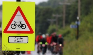 cycling events sign and riders